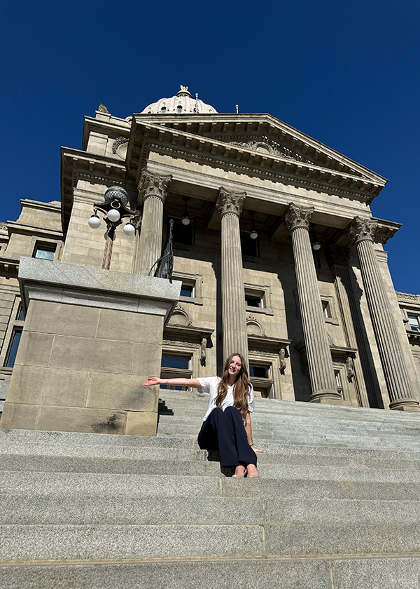 TerraGraphics International Foundation Legal Intern sitting on the steps of the Idaho State Capitol building.
