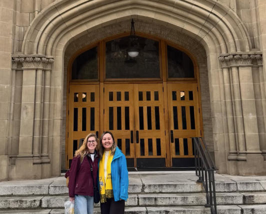 Marina and Gulzat outside the Administration Building at the University of Idaho